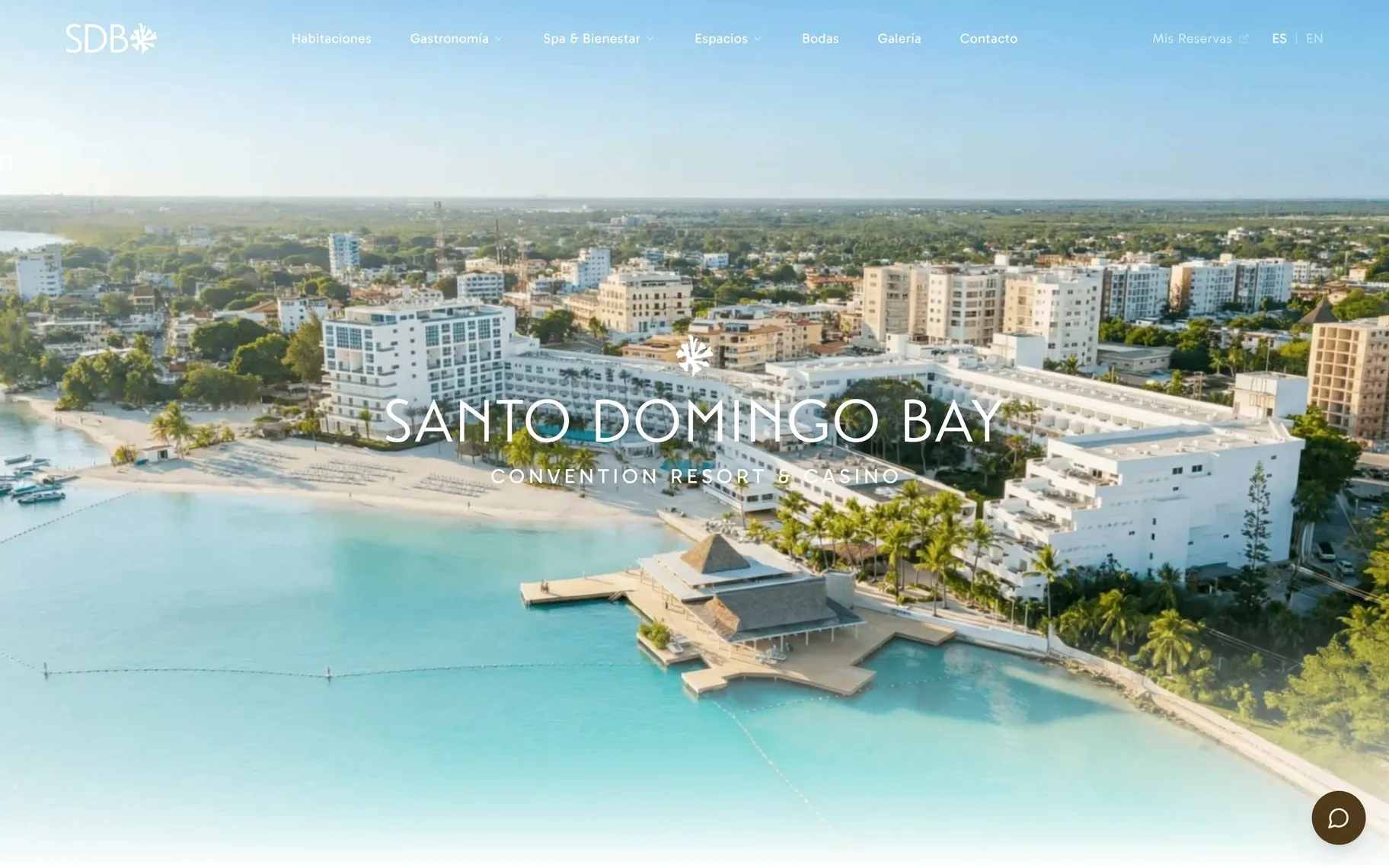 Home page of santodomingobay.com: the name Santo Domingo Bay Convention Resort & Casino over an aerial view of the resort's white buildings, beach and turquoise bay.
